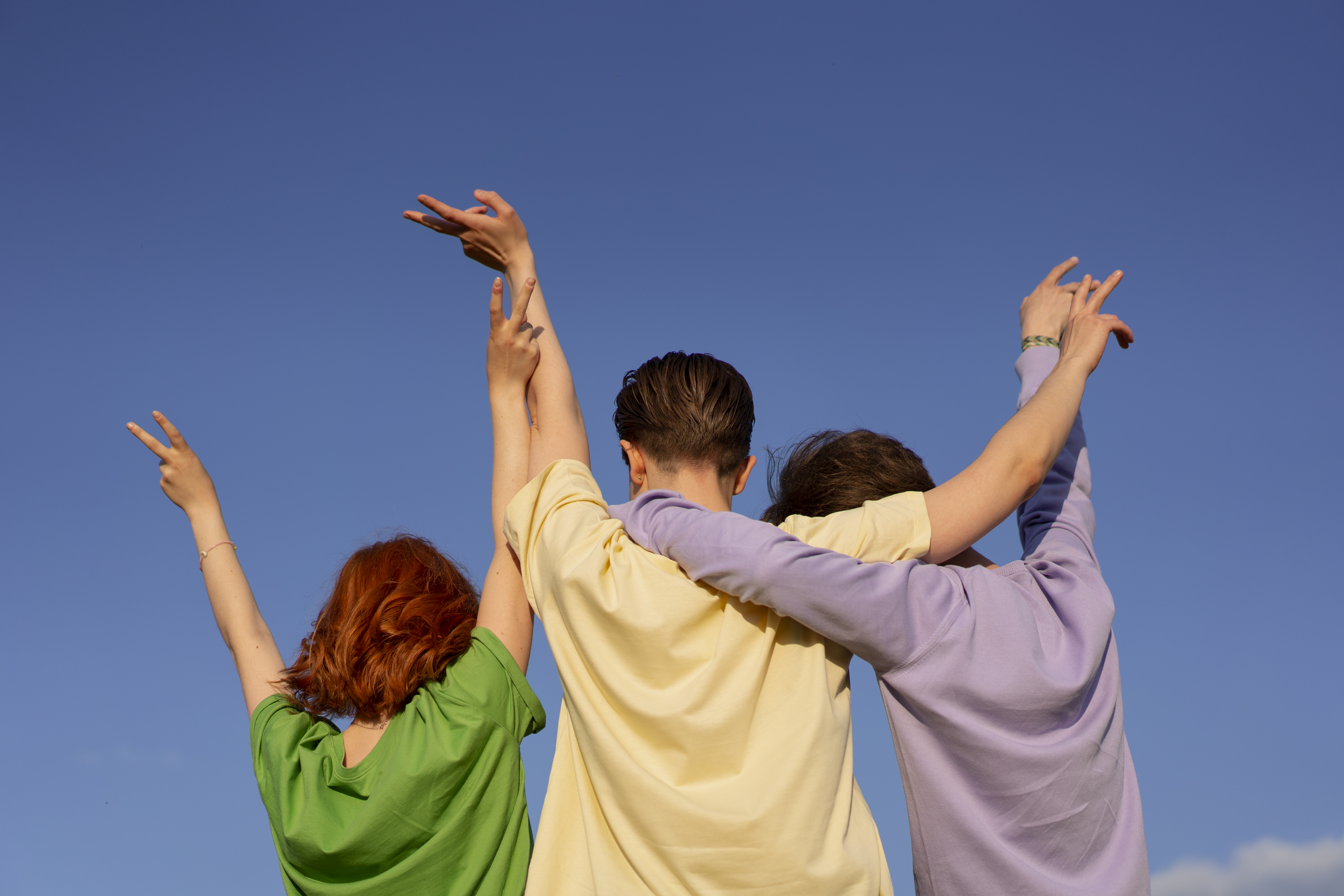 Three friends embracing